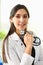 Beautiful smiling female doctor at workplace portrait