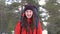 Beautiful smiling tourist portrait i na winter forest. HD.