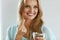 Beautiful Smiling Woman Taking Vitamin Pill. Dietary Supplement