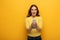 Beautiful smiling woman with tied hands with metal chain holding smartphone