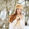 Beautiful smiling young woman portrat in winter