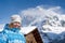 Beautiful smiling young woman. Swiss alps at winter