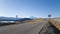 Beautiful smooth asphalt road and road signs on the roadside. Journey to the foot of mount Elbrus. Bright autumn Caucasus