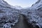 Beautiful snow covered mountains and a narrow path between them