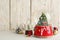 Beautiful snow globes and Christmas decor on light wooden table, space for text