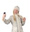 Beautiful snow maiden takes a selfie on the phone.
