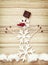 Beautiful snowman of snow flakes, matches, chocolate and chili p