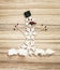 Beautiful snowman of snow flakes, matches, chocolate and chili p