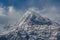 Beautiful snowy mountain surrounded by clouds at Mardi Himal trek