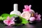 beautiful spa background of pink hibiscus flowers, leaf, candle, towel, thai herbal compress ball and stones with drops, closeup