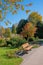 Beautiful spa garden Rottach-Egern with bench and colorful branches