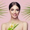 Beautiful spa woman with healthy skin, tropic flower