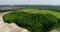 Beautiful space landscape. Aerial view of mystical green trees island on a field