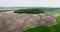 Beautiful space landscape. Aerial view of mystical green trees island on a field