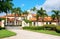 Beautiful Spanish style luxury mansion residential home with a privacy gate and palm trees