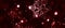 Beautiful sparkling snowflakes on a dark red backdrop, Christmas background. Panoramic orientation