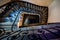 Beautiful spiral staircase with decorative metallic handrails  in ancient house