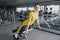 Beautiful sport woman doing press fitness exercise at gym