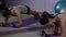 Beautiful sportive woman performing plank, finishing exercise, mirror reflection