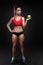 Beautiful sportly fitness girl holding an apple