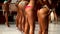 Beautiful sports slender young womens girls posing in a swimsuit in the of fitness bikini