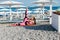 Beautiful sportswoman brunette yoga gymnastics fitness on the beach by the sea