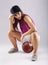 Beautiful and sporty female basketball player