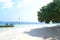 Beautiful spot on Pahawang Beach with tree swing and traditional fishing boat leaning back