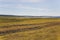 Beautiful sprig landscape. Mountain village in sunny day. Blue sky. Fields in april. Green grass on farm.