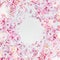 Beautiful spring blossom frame background. Round circle frame with pink blossom on white. Springtime nature, selective focus.