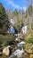 A beautiful spring landscape at Anna Ruby Falls with running water, rocks and lush green trees and plants in Unicoi State Park