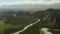 Beautiful spring landscape with mountains, forest and river. Aerial View. Drone shot over a beautiful mountain forest