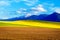 Beautiful spring plowed field and green and yellow meadow. Mountain in background. Slovakia, Central Europe, Liptov