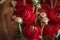 Beautiful spring red and green buttercup ranunculus bouquet of flowers on a wood background soft macro