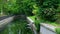 Beautiful spring river and forest. Nature Reflection of trees in the water. Abstract natural background. Blurry