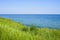 Beautiful spring seascape with green grass