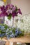 Beautiful spring and summer flowers on the table ready for bouquet. Many forget-me-not, lilac blossoms