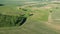 Beautiful spring time farmland fields with groves and trees, aerial