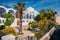 Beautiful spring view of garden at Fira Orthodox Cathedral. Colorful morning scene of the famous Greek resort - Thira, Santorini,