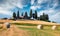 Beautiful spring view of wheat harvest in Tuscany. Sunny summer scene of Italian countryside. Traveling concept background.