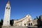 Beautiful square with church and high Bell Tower of ancient town