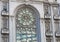 Beautiful stained glass window on classical european style building with church facade