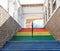 Beautiful staircase with steps of different colors, handrails for the disabled, social stairs