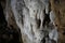 Beautiful stalactites are limestone sediments that form rods or stalactites from the cave ceiling