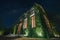 Beautiful starry sky and English country style building covered with green creeper plant