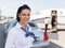 Beautiful Stewardess Standing Against Limousine