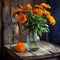 Beautiful still life of field orange Calendula flowers in a vintage glass jar on a wooden table in a rustic wooden interior.