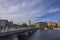 Beautiful Stockholm city landscape view. People walking on bridge over river. Old architecture buildings on background. Sweden.