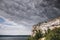 Beautiful stone cliff and big lake. Old stone caves, green hill and river landscape. Bakota lake and Dnister river in Ukraine.