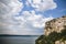 Beautiful stone cliff and big lake. Old stone caves, green hill and river landscape. Bakota lake and Dnister river in Ukraine.